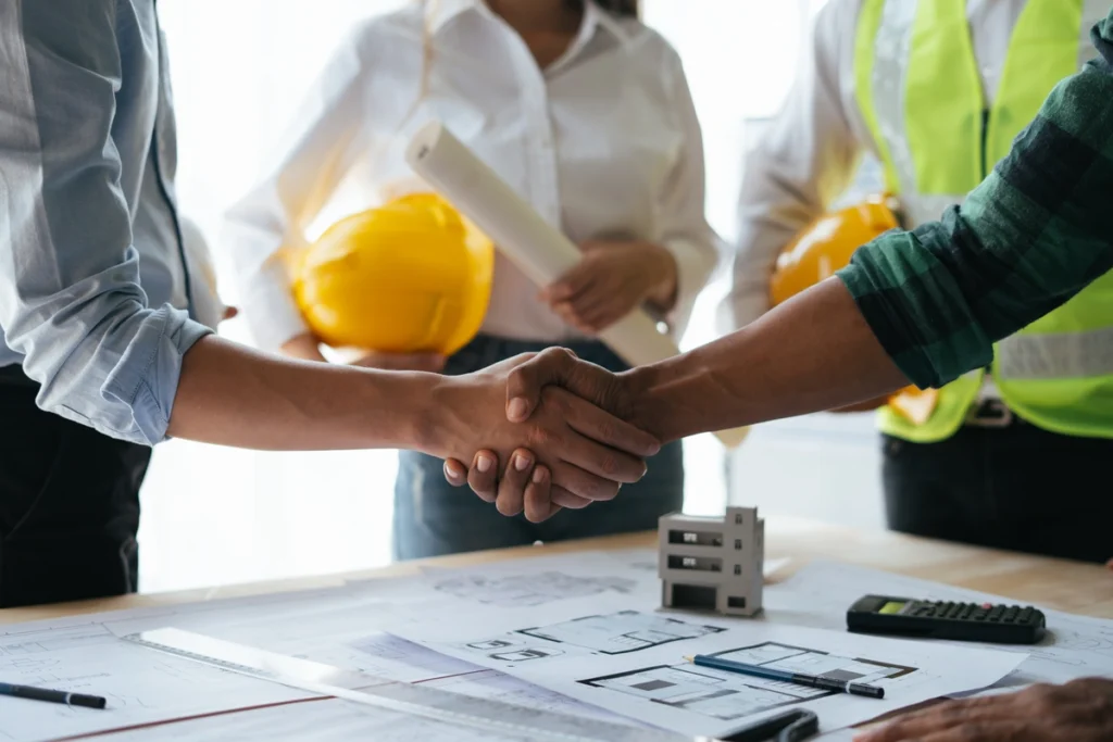 professional contractor hand shaking with client