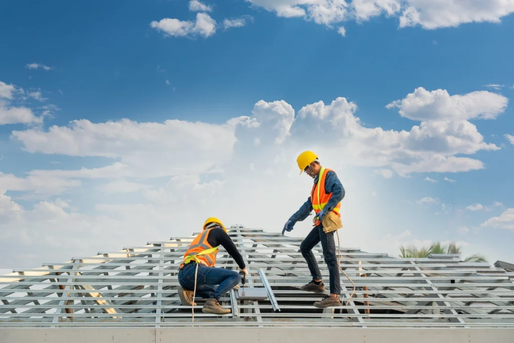workers building commercial roof