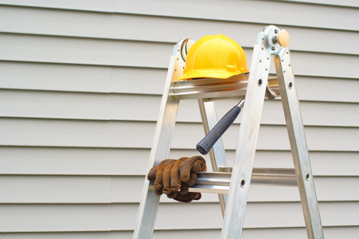 ladder in front of siding