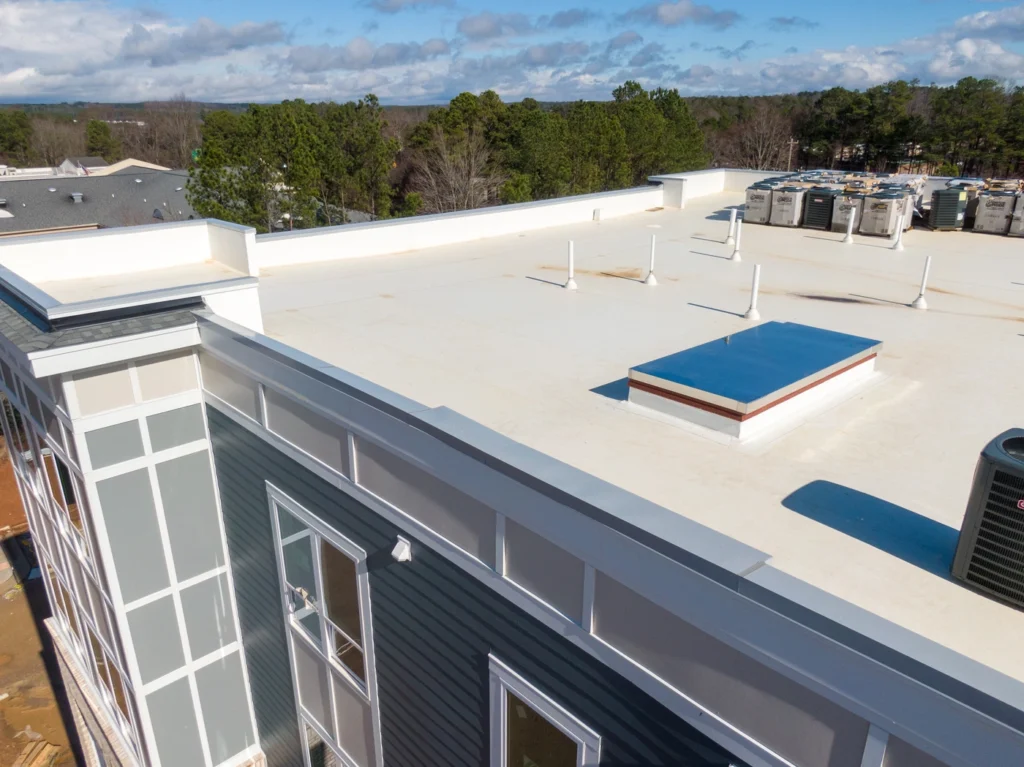 aerial view of tpo roof membrane installation on apartment building