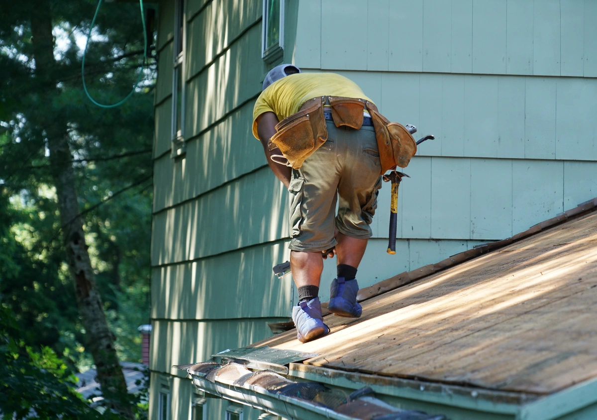 Homeowner On Roof