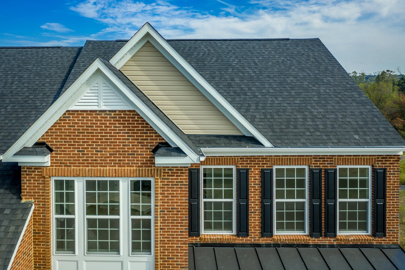 Brick home with new shingle roof replacement in Springfield PA