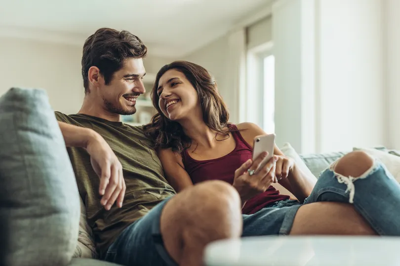 Homeowner couple from Horsham sitting on a couch