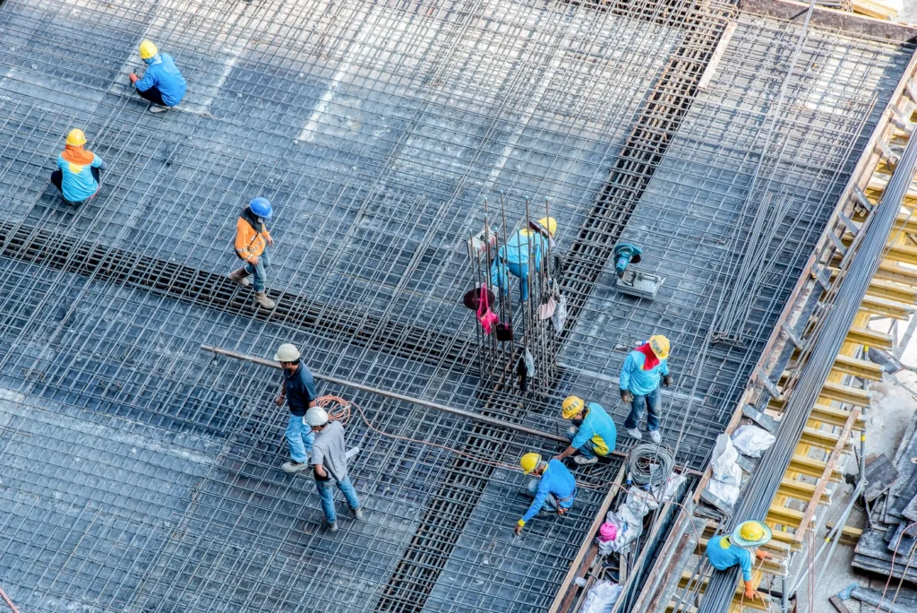 roofing contractors work on replacing commercial roofing system