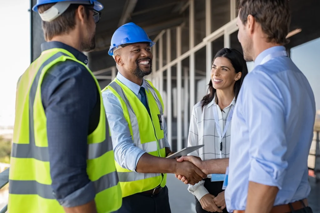 engineer and business man hand shaking