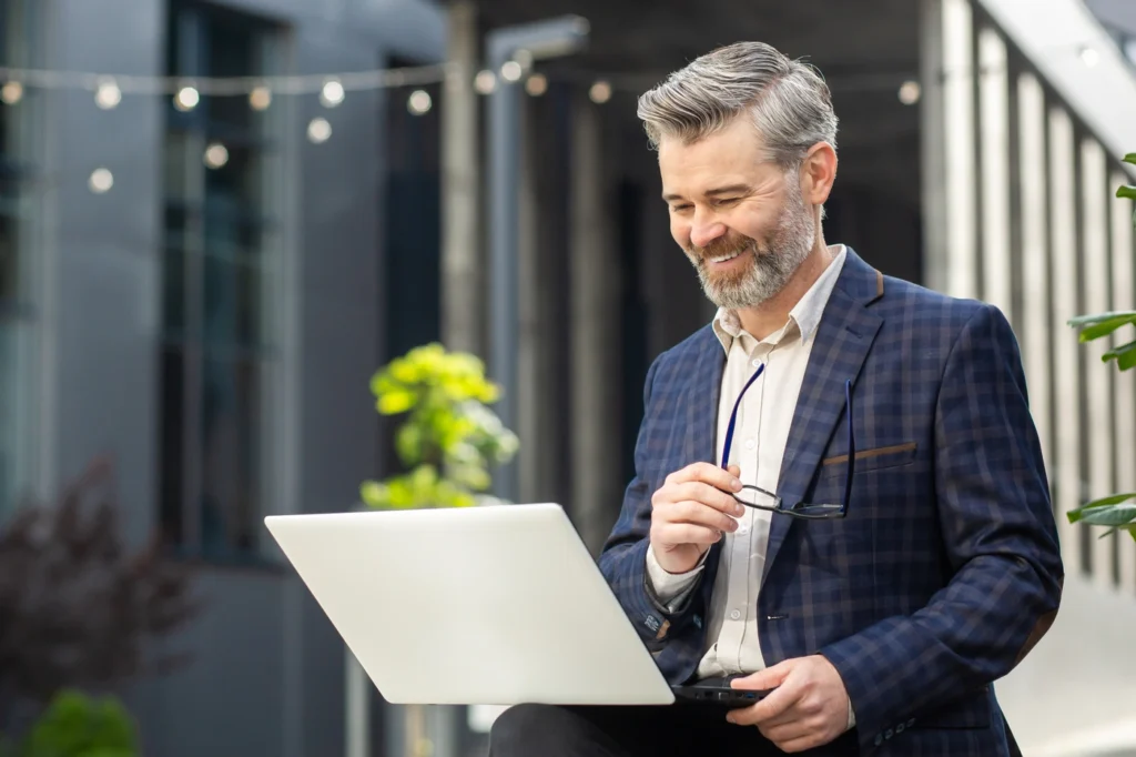businessman standing outside an office building