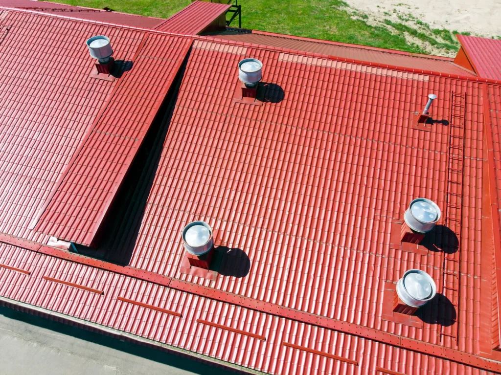 aerial view of red commercial metal roof installation