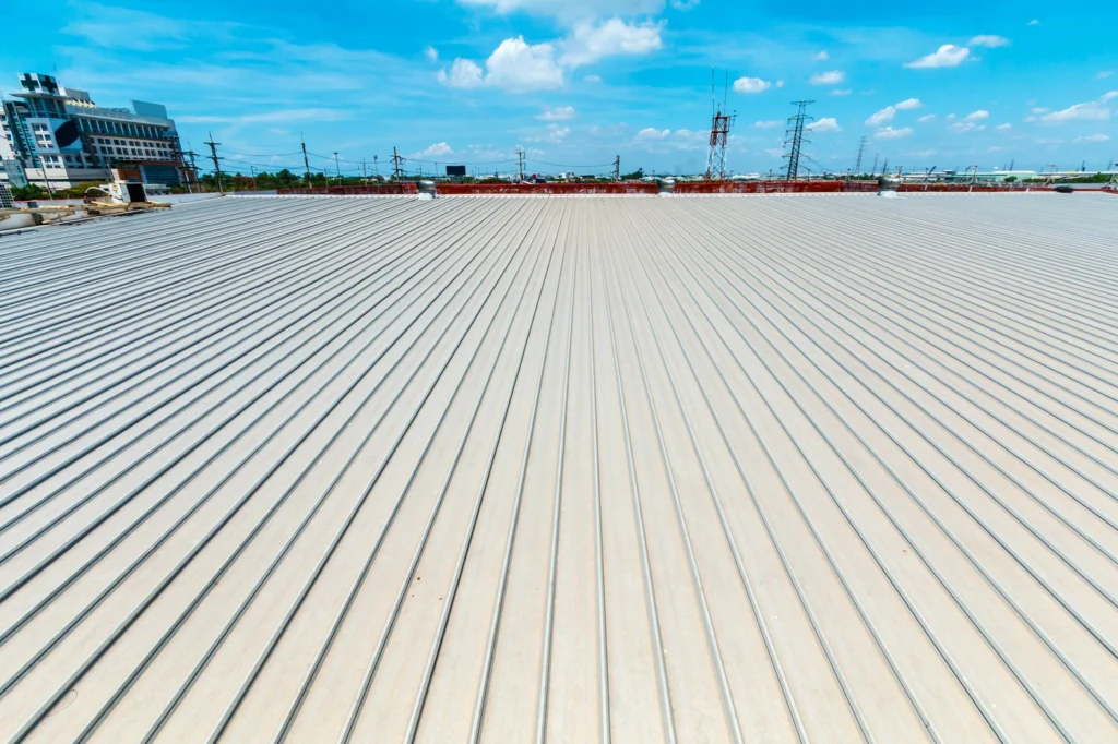 close up view of grey steel metal roofing system installed on commercial building