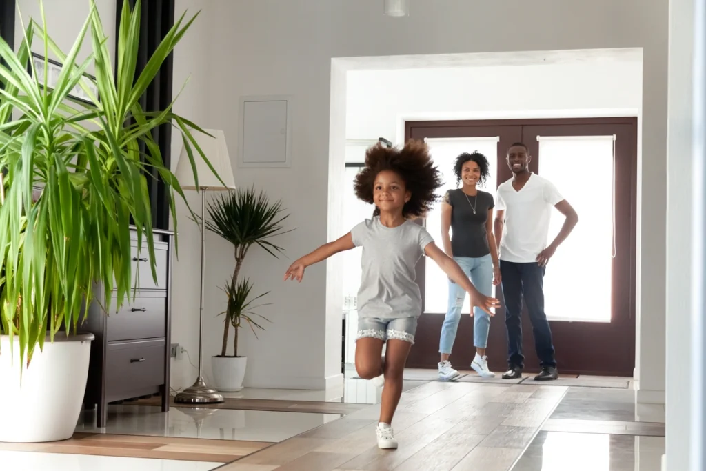 happy family entering home