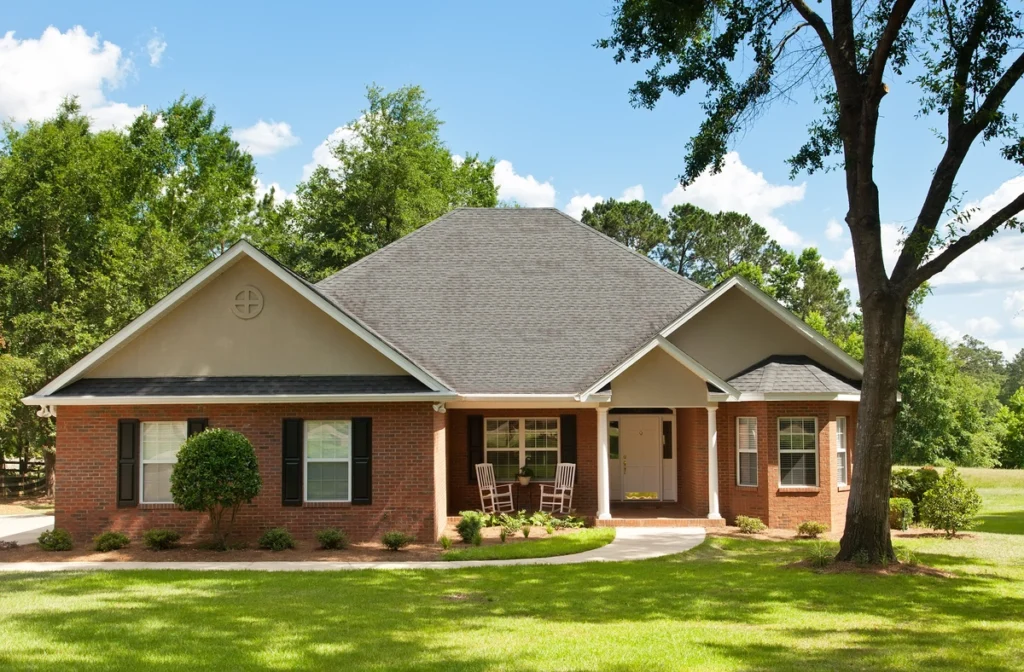 brick house with shingle roof