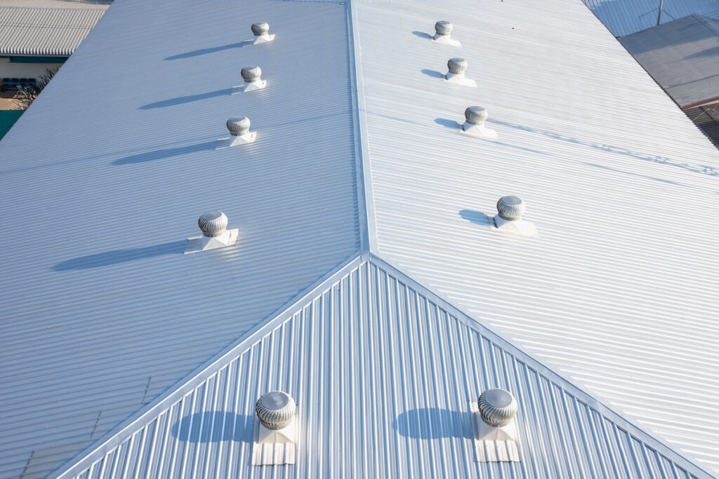 Aerial view of a white corrugated metal roof