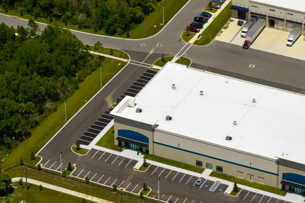 Aerial view of a large, white roofed commercial warehouse with tpo commercial roofing in Hatboro PA