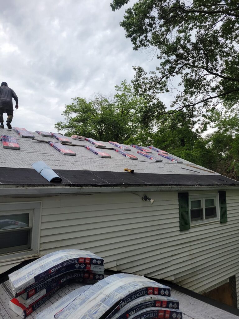 crew loading shingles on roof lafayette hill pa 12